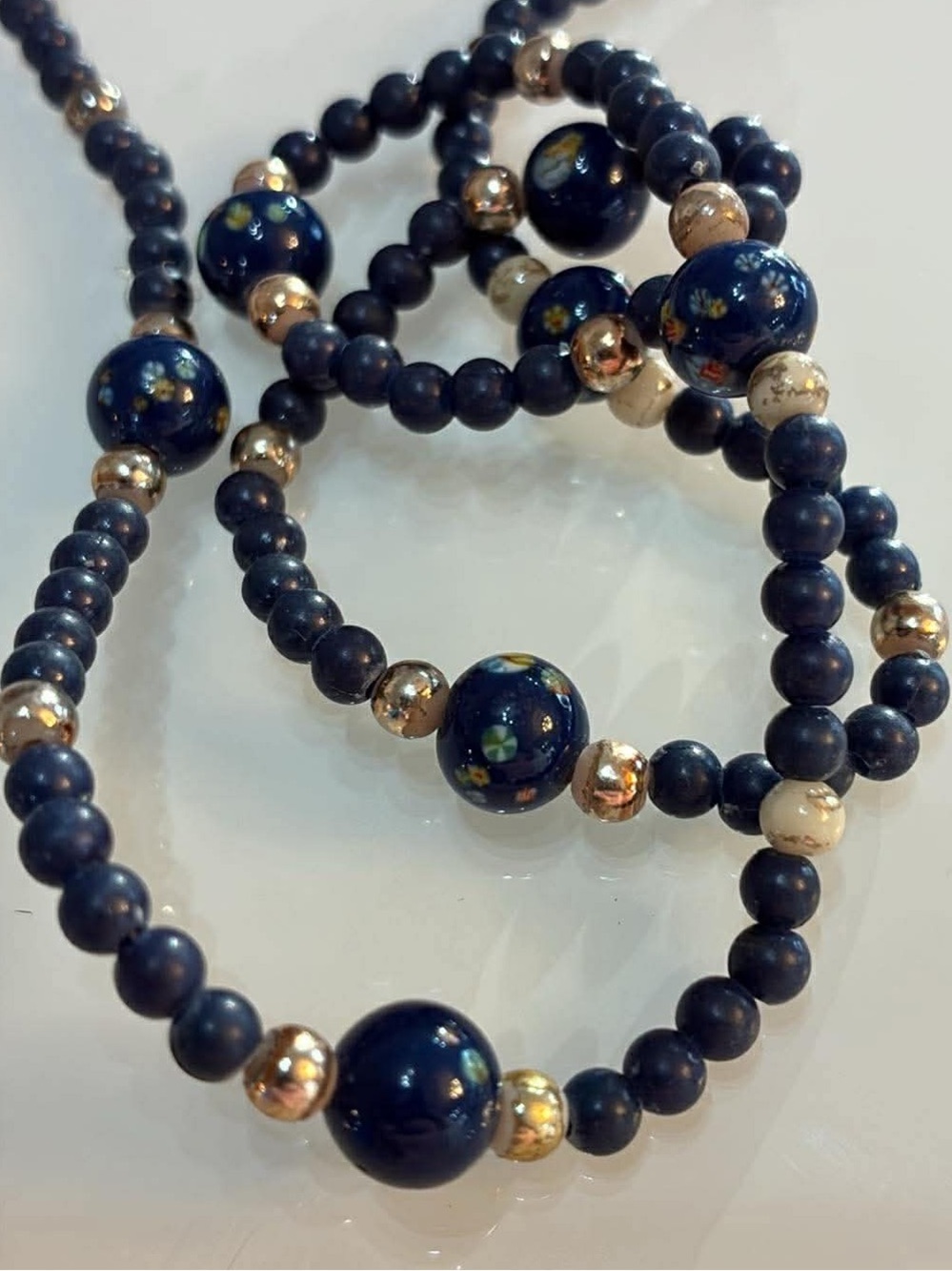 Handcrafted Navy Blue Beaded Bracelet with floral Accents